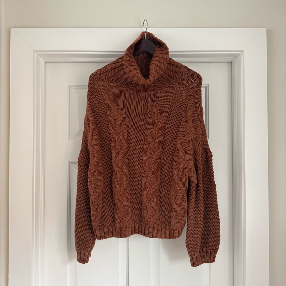 Women’s cowl neck cable knit sweater